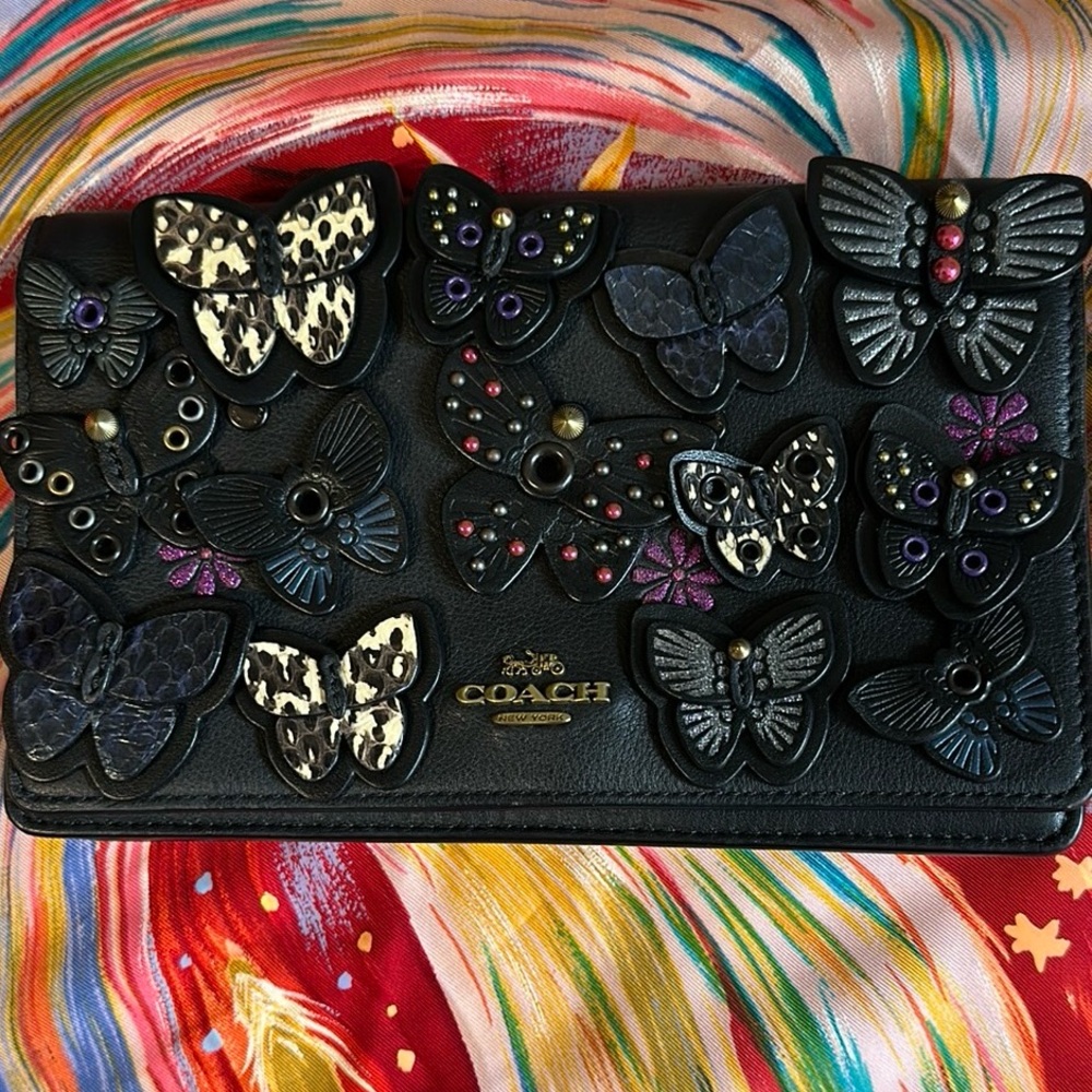 Coach Black Butterfly Embellished Wallet

8" (L) x 4 3/4" (H) x 2 1/4" (W)